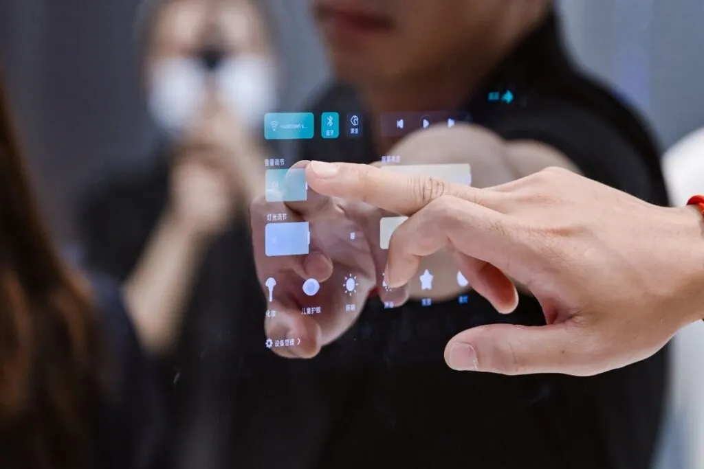 Hand interacting with the digital touch interface on a commercial smart interactive mirror